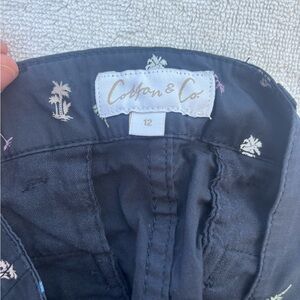 Cotton & Co. navy boys shorts. Navy with pastel embroidered palm trees.